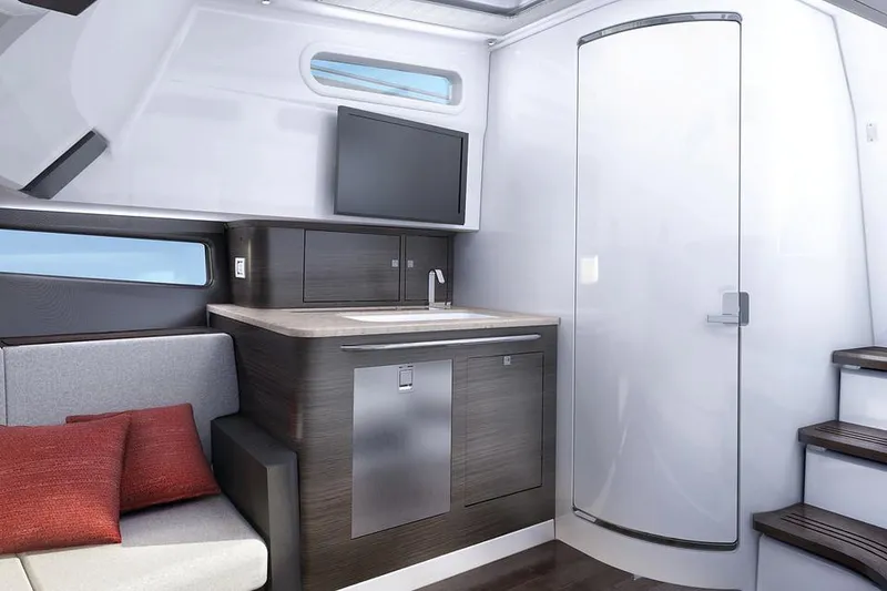 Slide: The Image of Manufacturer Provided Image: Interior of 2020 Boston Whaler 420 Outrage with modern kitchenette and seating area. - 11