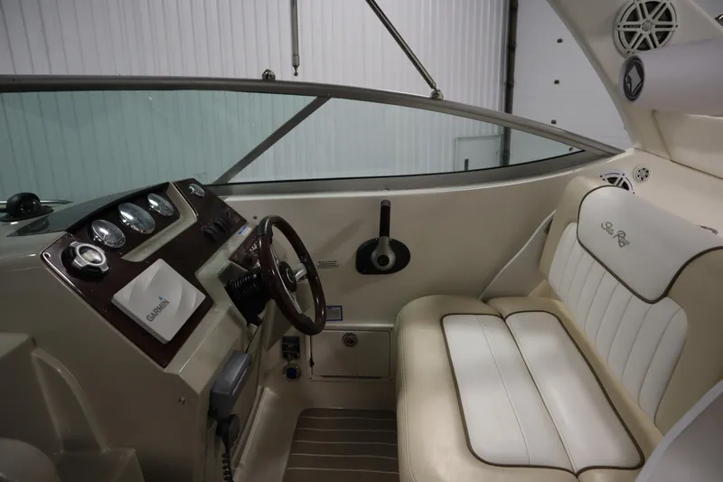 Slide: The Image of Interior of 2013 Sea Ray 280 Sundancer boat with steering wheel and seating. - 18