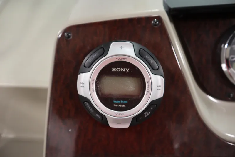 Slide: The Image of Sony marine audio control on 2013 Sea Ray 280 Sundancer dashboard. - 23
