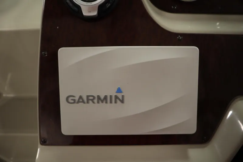 Slide: The Image of Garmin device on 2013 Sea Ray 280 Sundancer dashboard. - 24