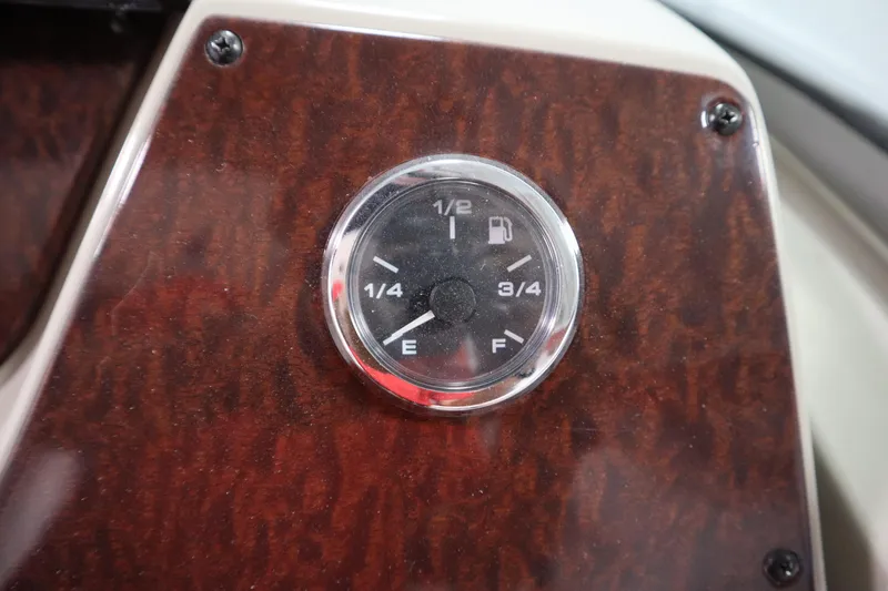Slide: The Image of Fuel gauge on 2013 Sea Ray 280 Sundancer dashboard, showing quarter tank. - 27