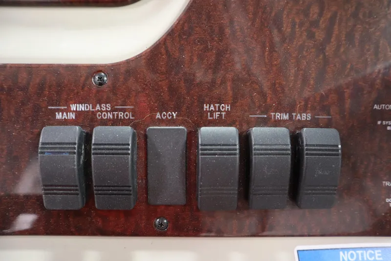 Slide: The Image of Control panel of a 2013 Sea Ray 280 Sundancer boat with labeled switches. - 28