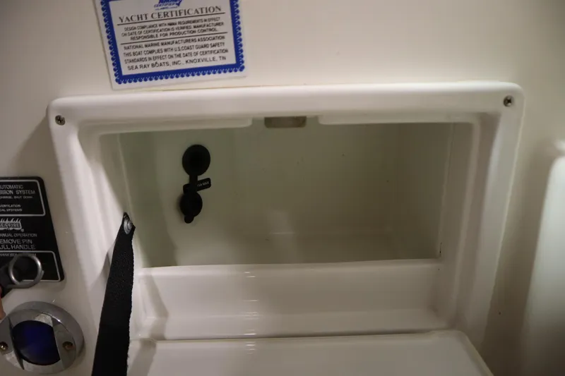 Slide: The Image of Storage compartment on a 2013 Sea Ray 280 Sundancer boat with yacht certification label. - 35