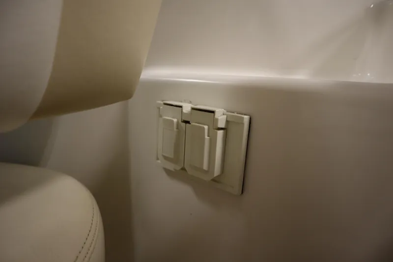 Slide: The Image of Interior of 2013 Sea Ray 280 Sundancer showing electrical outlet cover. - 38