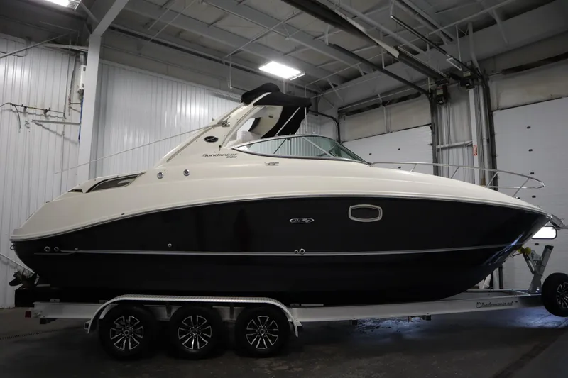Slide: The Image of 2013 Sea Ray 280 Sundancer boat on trailer in indoor storage facility. - 4