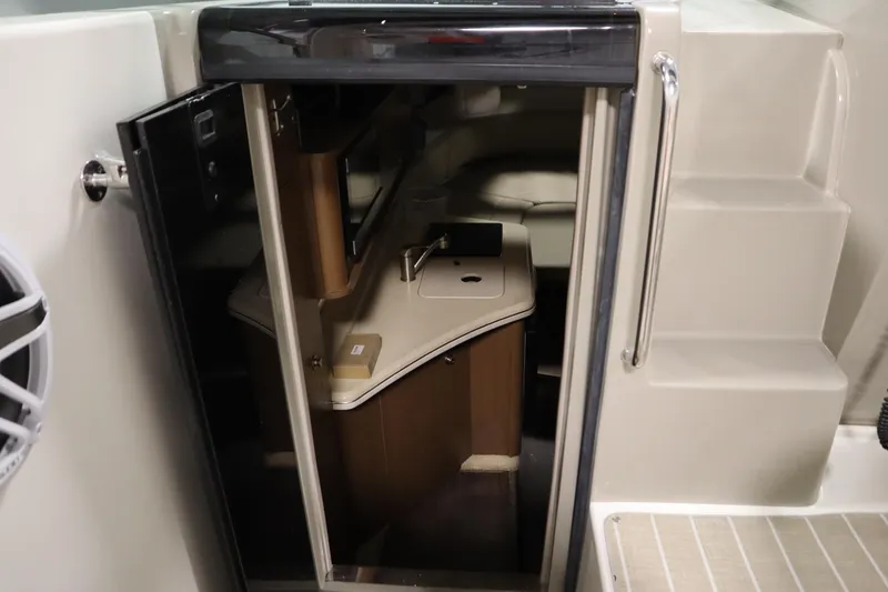 Slide: The Image of Interior view of 2013 Sea Ray 280 Sundancer cabin with kitchenette and seating area. - 40