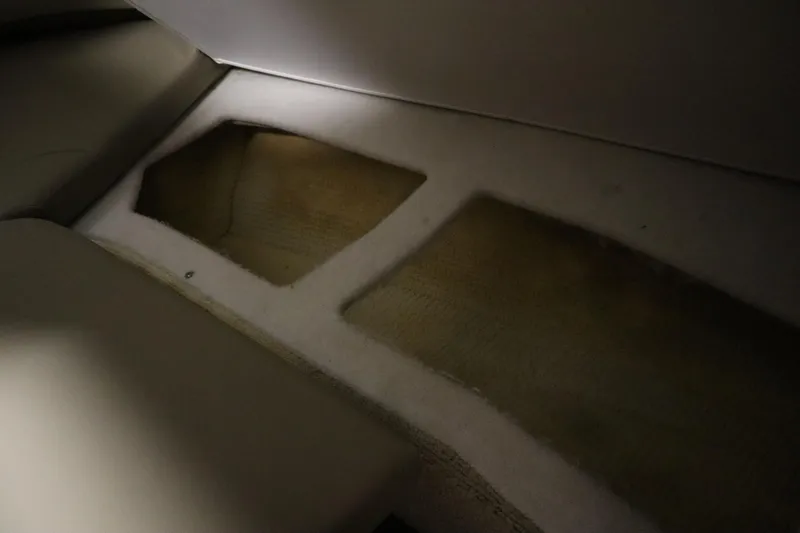 Slide: The Image of Interior storage compartments of a 2013 Sea Ray 280 Sundancer boat. - 42