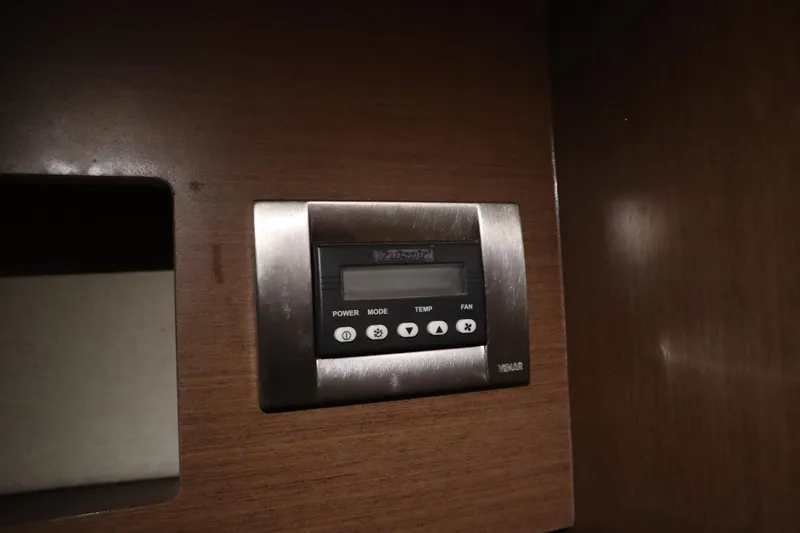 Slide: The Image of Control panel on 2013 Sea Ray 280 Sundancer boat, featuring power, mode, temperature, and fan settings. - 45