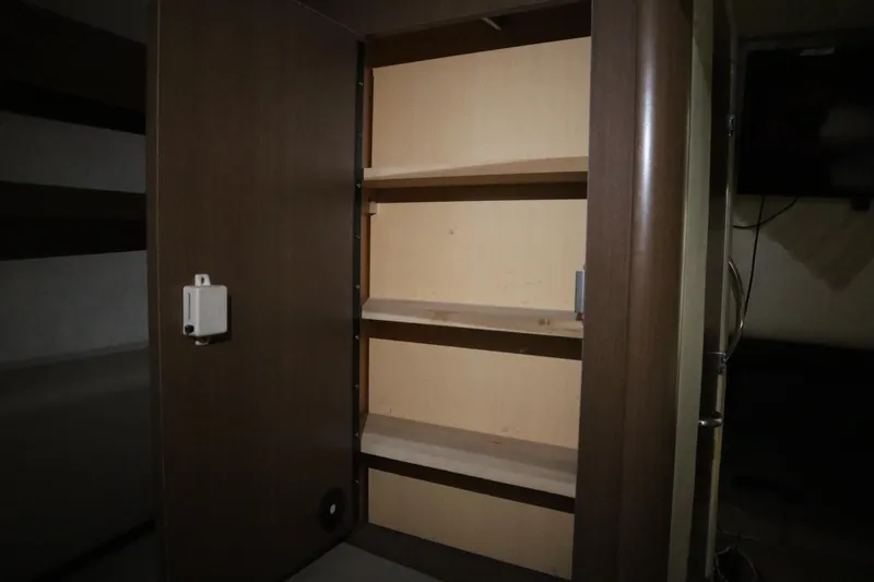 Slide: The Image of Empty wooden cabinet inside 2013 Sea Ray 280 Sundancer boat interior. - 47