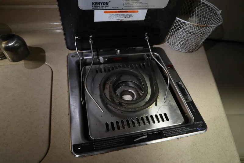 Slide: The Image of Kenyon stove on 2013 Sea Ray 280 Sundancer boat kitchen countertop. - 51