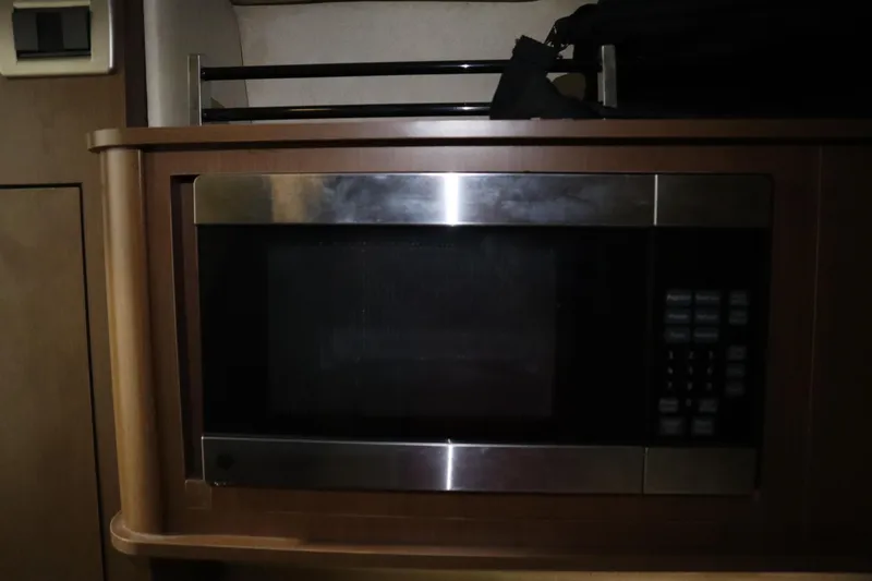 Slide: The Image of Built-in microwave in 2013 Sea Ray 280 Sundancer boat interior. - 54