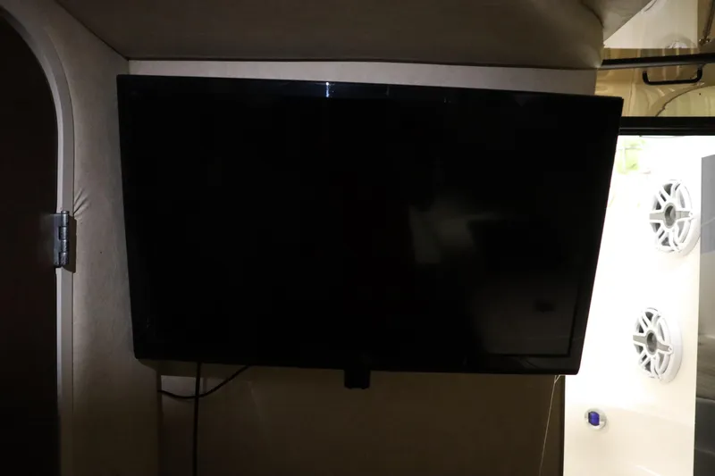 Slide: The Image of Flat-screen TV inside 2013 Sea Ray 280 Sundancer boat cabin. - 58