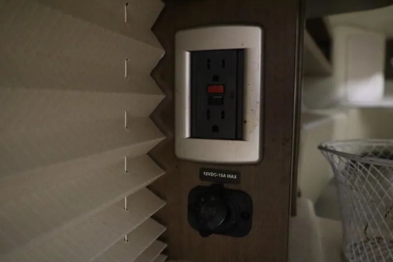 Slide: The Image of Power outlet and switch inside 2013 Sea Ray 280 Sundancer boat cabin. - 66