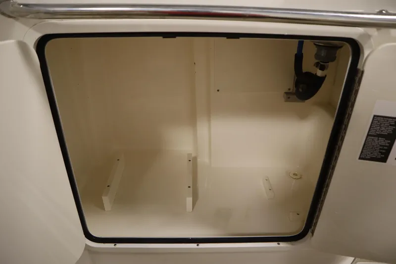 Slide: The Image of Storage compartment of a 2013 Sea Ray 280 Sundancer boat, interior view. - 72