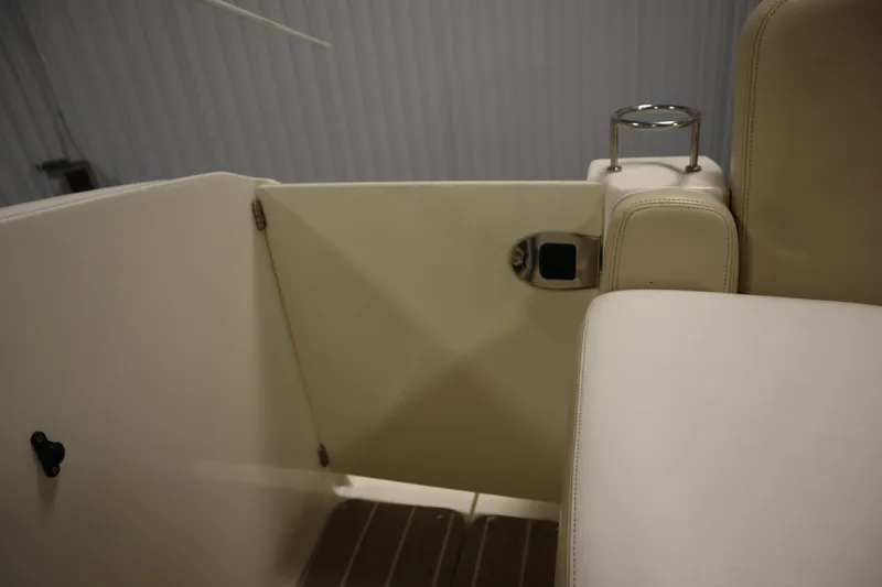 Slide: The Image of 2013 Sea Ray 280 Sundancer interior with beige seating and door detail. - 75