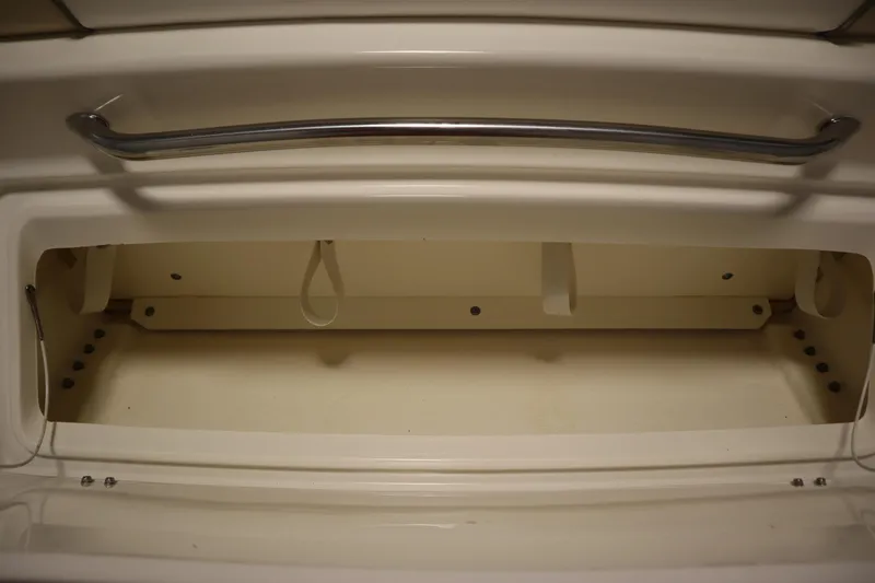 Slide: The Image of Storage compartment on a 2013 Sea Ray 280 Sundancer boat, featuring a sleek handle. - 77