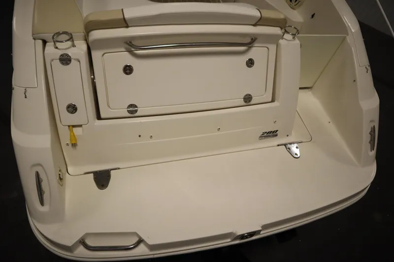 Slide: The Image of 2013 Sea Ray 280 Sundancer boat stern with storage compartment and swim platform. - 79