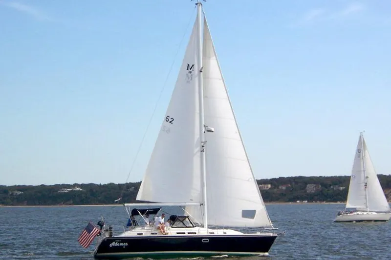 The Image of Sailboat Catalina Morgan 38 Center Cockpit 1997 on open water with American flag. - 0