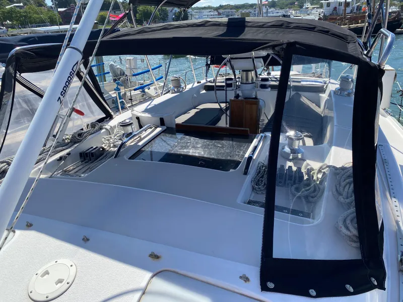 Slide: The Image of 1997 Catalina Morgan 38 sailboat cockpit with black canopy, docked in a marina. - 13