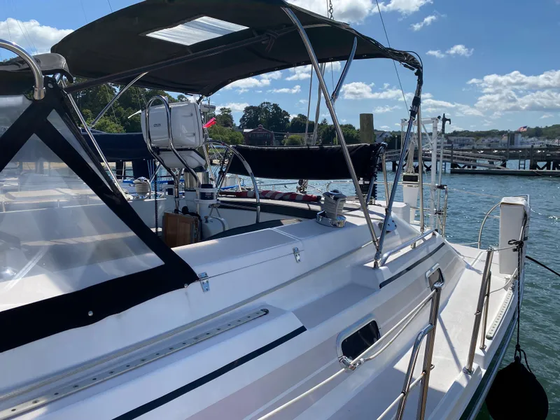 Slide: The Image of Sailboat Catalina Morgan 38, 1997 model, docked at marina under sunny skies. - 15