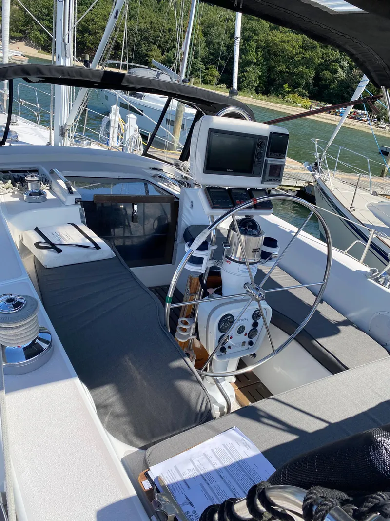 Slide: The Image of Cockpit of a 1997 Catalina Morgan 38 sailboat with steering wheel and navigation equipment. - 20