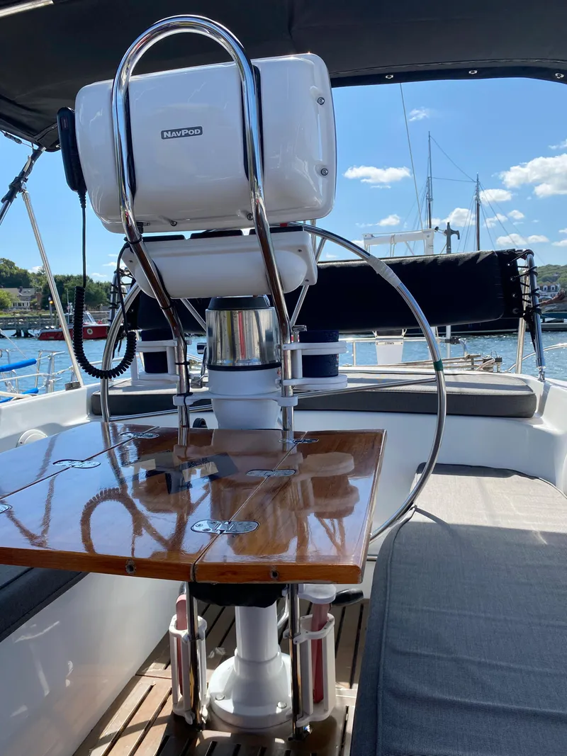 Slide: The Image of Cockpit of 1997 Catalina Morgan 38 sailboat with polished wooden table and steering wheel. - 21