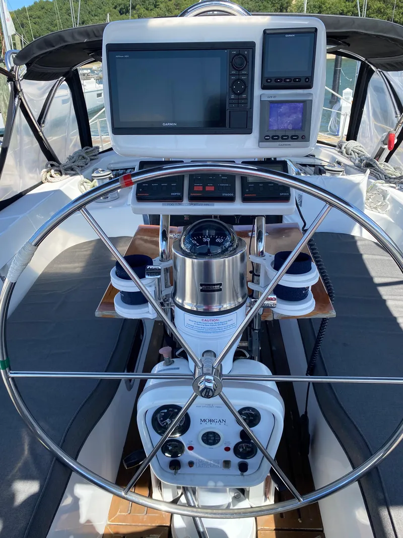 Slide: The Image of Cockpit of 1997 Catalina Morgan 38 sailboat with navigation equipment and steering wheel. - 22