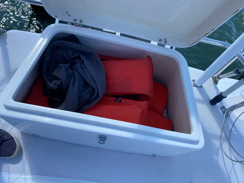 Slide: The Image of Open storage compartment on 1997 Catalina Morgan 38 sailboat with life jackets inside. - 28