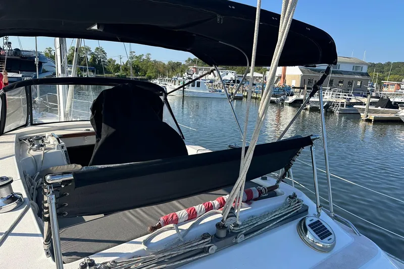 Slide: The Image of Sailboat Catalina Morgan 38, 1997 model, docked at a marina with clear skies. - 30