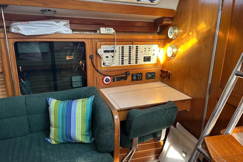 Slide: The Image of Cozy interior of 1997 Catalina Morgan 38 sailboat with navigation station and seating area. - 38