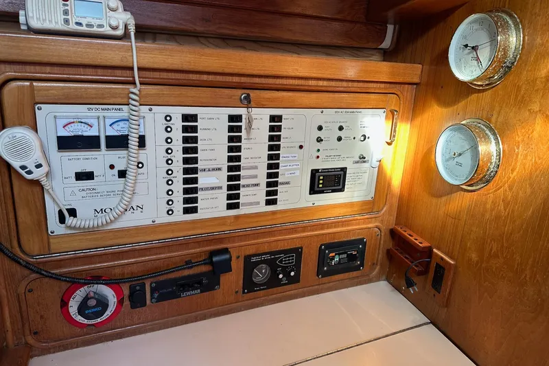 Slide: The Image of Control panel of a 1997 Catalina Morgan 38 sailboat with gauges and switches. - 40