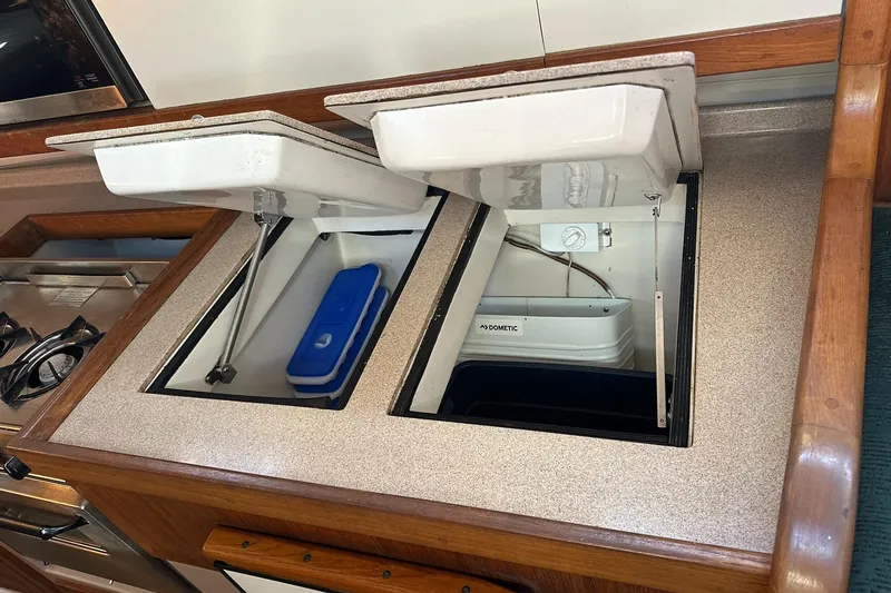 Slide: The Image of Interior of 1997 Catalina Morgan 38 yacht showing open storage compartments. - 45
