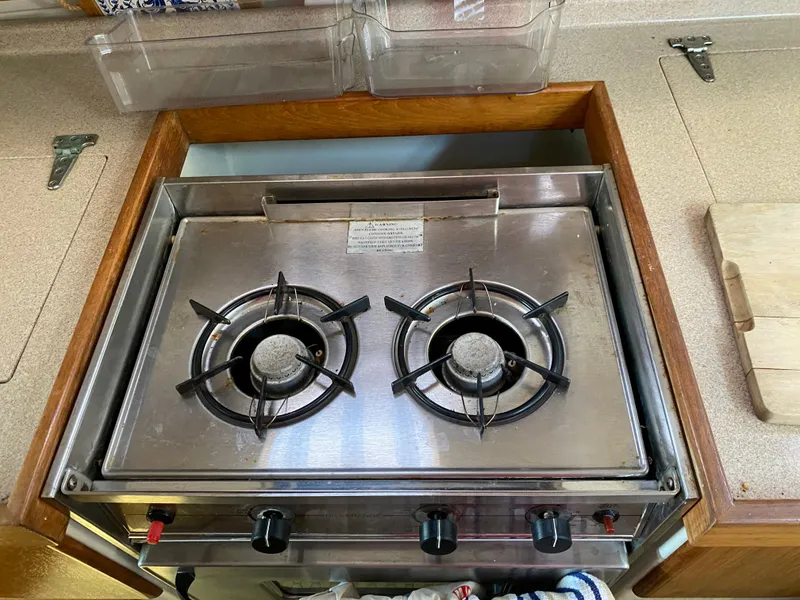 Slide: The Image of Stainless steel two-burner stove on a 1997 Catalina Morgan 38 yacht. - 46