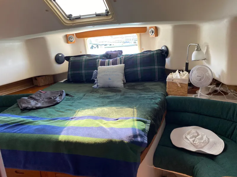 Slide: The Image of Cozy cabin interior of 1997 Catalina Morgan 38 sailboat with bed and seating area. - 51