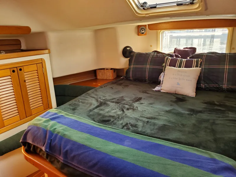 Slide: The Image of Cozy cabin interior of 1997 Catalina Morgan 38 sailboat with plush bedding. - 52