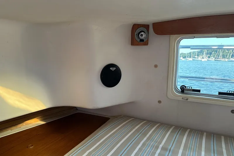Slide: The Image of Cozy cabin interior of 1997 Catalina Morgan 38 sailboat with window view of marina. - 61