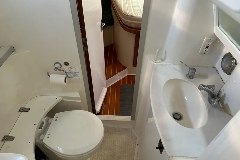 Slide: The Image of Bathroom interior of 1997 Catalina Morgan 38 yacht, featuring toilet and sink. - 64