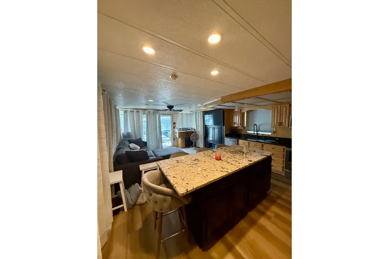 Slide: The Image of Interior of 2003 Horizon houseboat with modern kitchen and cozy living area. - 14