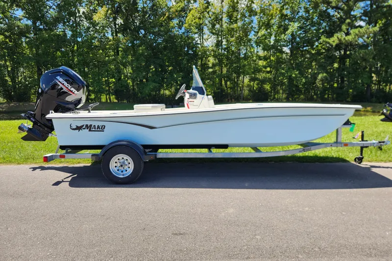 The Image of 2026 Mako Pro Skiff 17 CC boat on trailer, parked on a sunny day. - 0