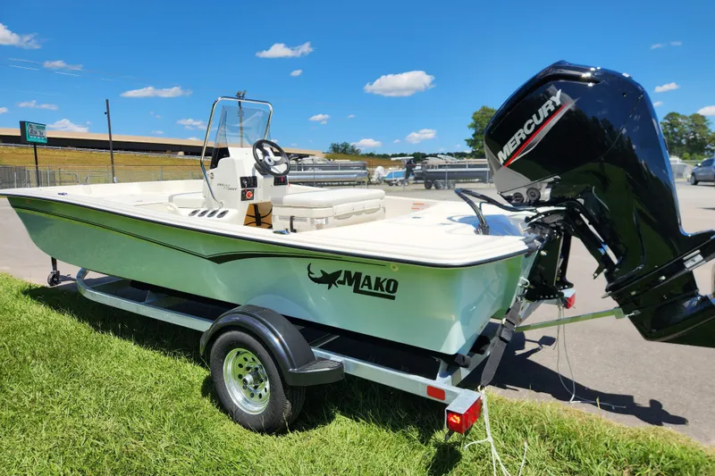 Slide: The Image of 2026 Mako Pro Skiff 17 CC boat on trailer with Mercury outboard motor. - 4