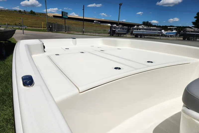 Slide: The Image of 2026 Mako Pro Skiff 17 CC boat deck, white finish, outdoor display. - 7