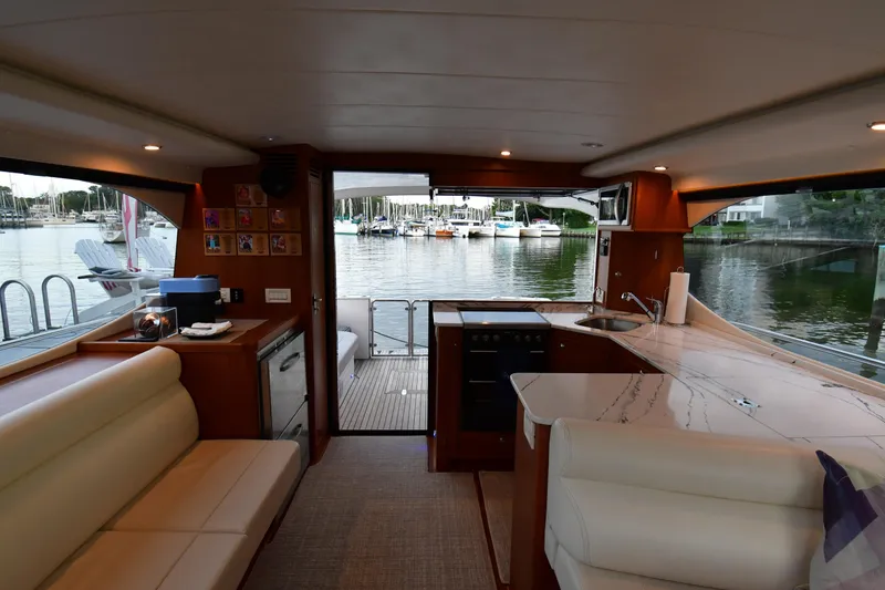 Slide: The Image of Interior of 2021 Hylas M44 yacht with modern kitchen and marina view. - 14