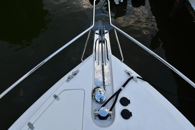Slide: The Image of Bow of 2021 Hylas M44 yacht with anchor chain and railing, docked on calm water. - 20