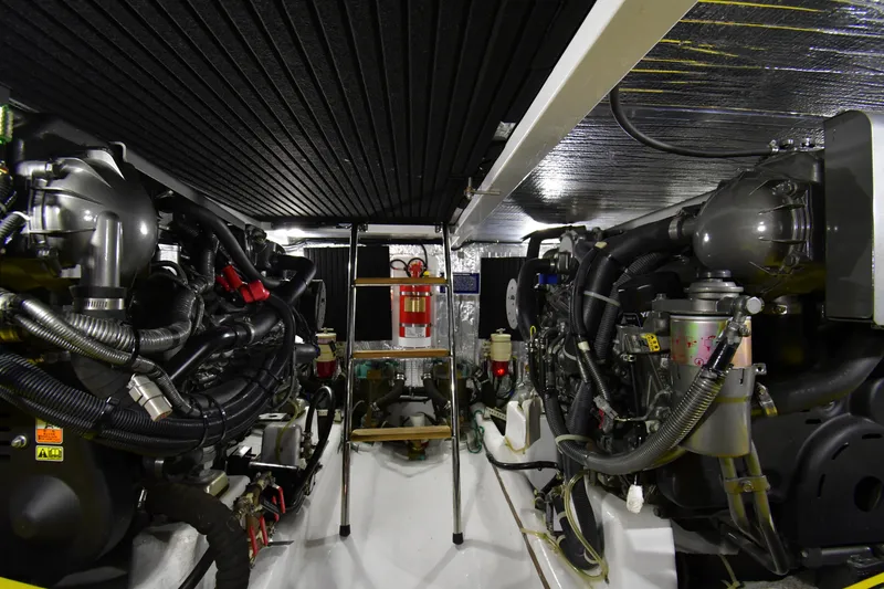 Slide: The Image of Engine room of a 2021 Hylas M44 yacht, featuring complex machinery and equipment. - 21