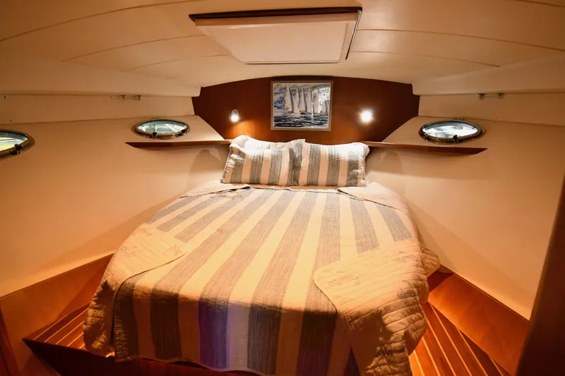 Slide: The Image of Luxurious cabin interior of 2021 Hylas M44 yacht with cozy bed and ambient lighting. - 8