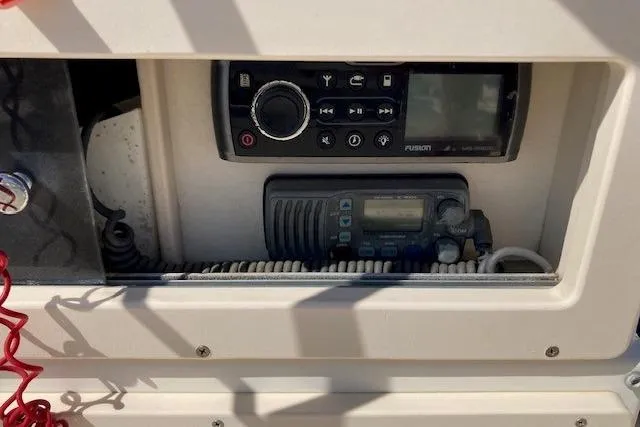 Slide: The Image of Control panel of a 2007 Jones Brothers 200 Bateau boat with radio and navigation equipment. - 12