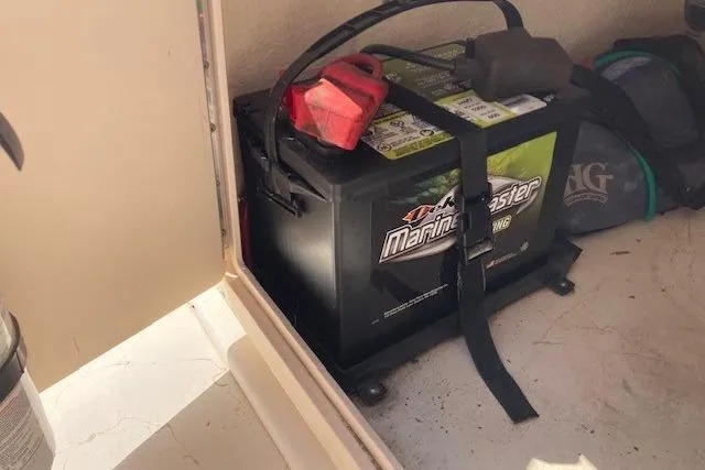 Slide: The Image of Marine battery inside a 2007 Jones Brothers 200 Bateau boat compartment. - 13