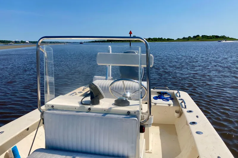 Slide: The Image of 2007 Jones Brothers 200 Bateau boat on calm water under clear blue sky. - 3