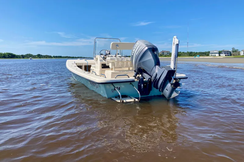 Slide: The Image of 2007 Jones Brothers 200 Bateau boat in shallow water, clear blue sky background. - 5