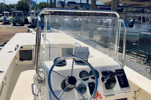 Slide: The Image of 2007 Jones Brothers 200 Bateau boat dashboard with steering wheel and controls. - 8